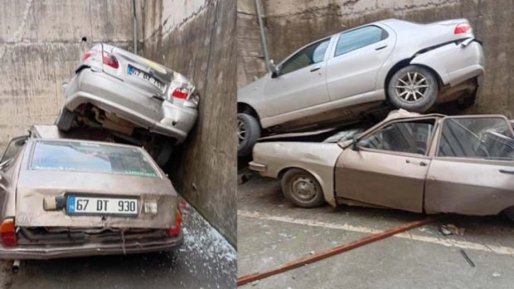 Rampadan geri kayıp 8 metrelik duvardan düştü: Park halindeki aracın üzerine çıktı