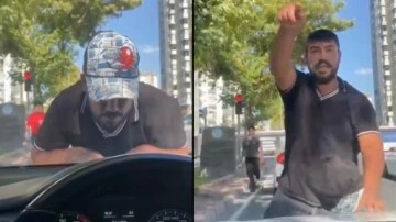 Cam silme bahanesiyle aracın kaputuna yatıp zorla para istemişti, tutuklandı
